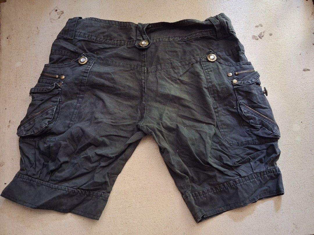 Dark Grey Cargo Shorts with Embellished Buttons (Category: Shorts) located in Cabanatuan. Submitted by ronnelpena (Listing ID 1443169923, Image 1). Description: - Dark grey wash cargo shorts - Multiple pockets with zip details - Button fly closure with subtle sparkle buttons - Cropped length with cuffed hem - Ideal for casual wear.