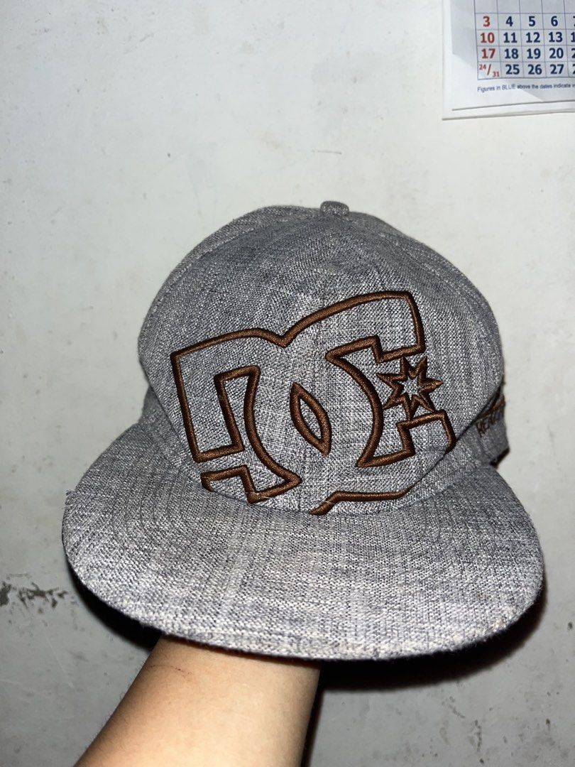 DC Shoes "Real Fire" Snapback Cap Grey DUPE (Category: Caps & Hats) located in Surigao. Submitted by hannxaii (Listing ID 1443173447, Image 1). Description: - Grey DC Shoes snapback cap - Classic DC logo embroidered in brown on the front - 'Real Fire' embroidery on the side - Small DC logo on the back - Size: 7 1/8 (57cm) - Ideal for any DC fan DUPE.