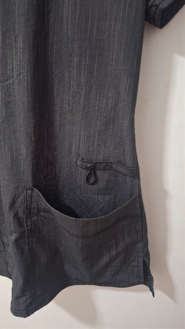 Dickies Grey Striped V-Neck Scrub Top (Category: Others Tops) located in Quezon City. Submitted by _helpmedeclutter (Listing ID 1443163593, Image 2). Description: - Grey scrub top with subtle vertical stripes - V-neck design - Two front pockets - Small loop detail on left chest pocket - Short sleeves - Comfortable and practical for work.