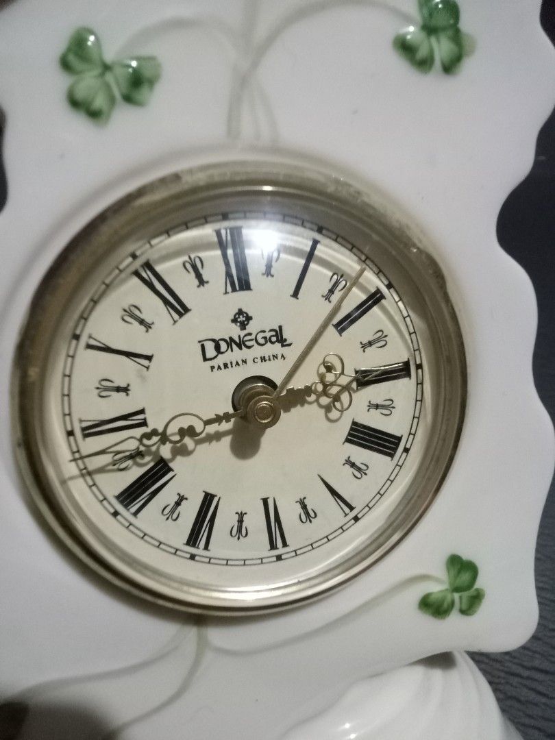 Donegal Irish China Clock - Ireland Map Design (Category: Clocks) located in Makati City. Submitted by pardsroman (Listing ID 1443128127, Image 2). Description: - Unique clock shaped like Ireland - Adorned with charming shamrock decorations - Features an authentic Donegal Irish China clock face - Ideal for Irish enthusiasts and collectors - Rests on a stable white base - Approximate height: [insert height here].