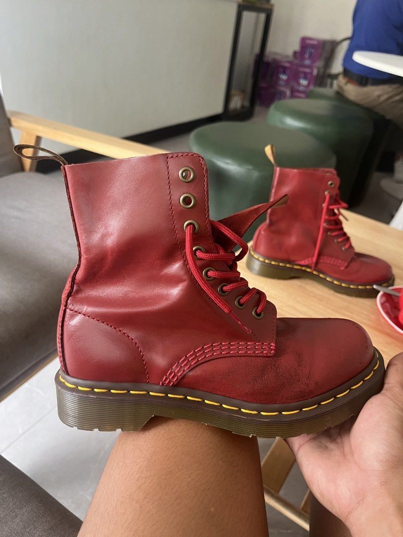 Authentic Dr. Martens Red Leather Lace-Up Boots (Category: Boots) located in Bago City. Submitted by michaelsuy46339 (Listing ID 1443159249, Image 2). Description: - Classic Dr. Martens boots in vibrant red - Made from durable leather - Iconic yellow stitching - Original air-cushioned soles - Gently pre-loved with plenty of life left - Adds an edgy touch to any outfit.