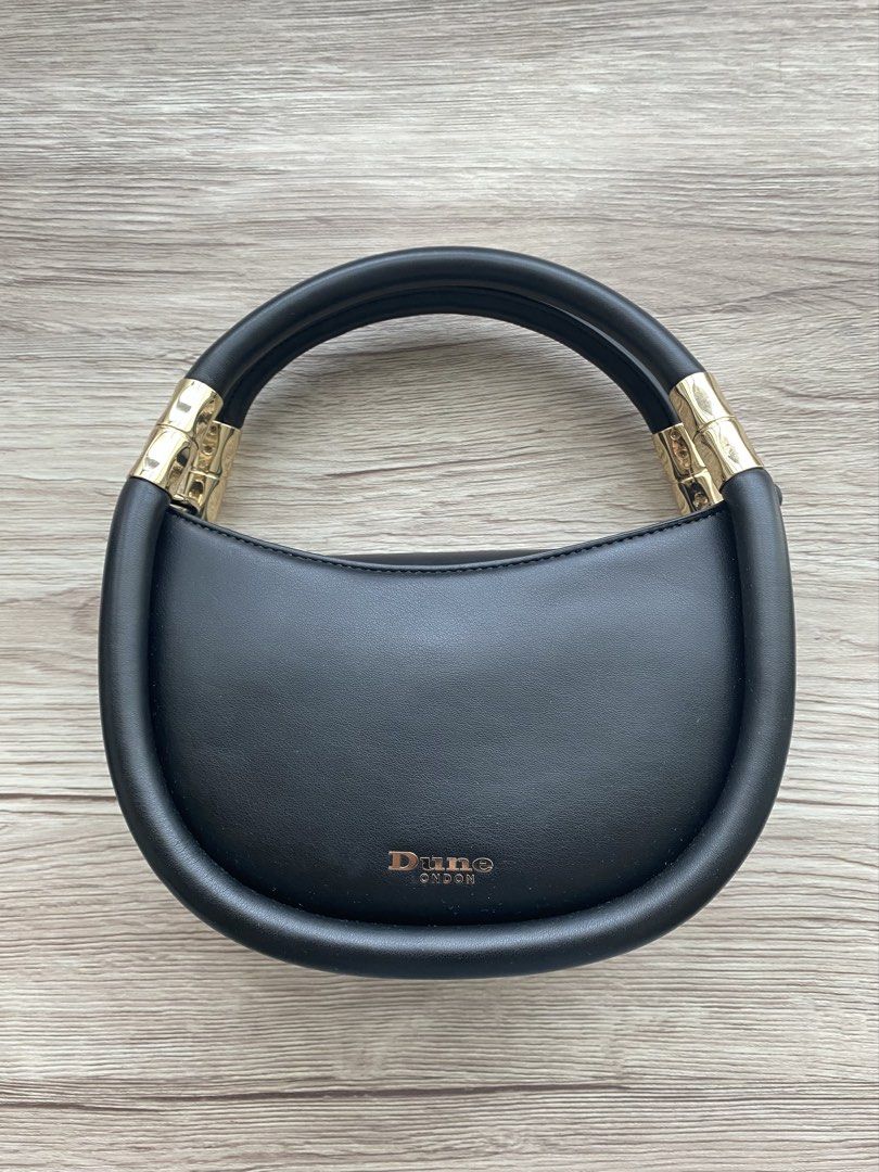 Dune London Daphny Black Day Bag (Category: Luxury Bags & Wallets) located in Makati City. Submitted by evenlysh (Listing ID 1443178693, Image 1). Description: Dune London Black Day Bag Mini Top Handle Bag Handbag Crossbody Bag H22 x W20 x D6cm Black Faux Leather, Gold Hardware Accents Lightly used (With Strap and Dust bag) Bought February 2025 at Dune London Villagio Mall in Doha, Qatar Fixed last price at P1000 + SF (ORP is P2800).