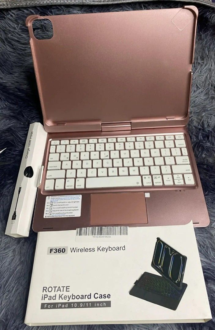 F360 Wireless Rotating iPad Keyboard Case for 10.9/11 Inch (Category: Cases & Sleeves) located in Taguig. Submitted by jerafelsan87737 (Listing ID 1443312372, Image 1). Description: - Rose gold wireless keyboard case - Compatible with iPad 10.9/11 inch - Rotates for versatile viewing angles - Includes charging cable - Comes with original packaging - Ideal for productivity on the go.