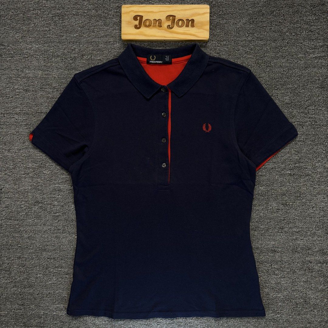 (Sale) Fred Perry Poloshirt (Category: Activewear) located in Cavite. Submitted by onebeancent (Listing ID 1443309824, Image 2). Description: 🔘Fr3d P3.rry Size: Small to medium (Women) Dimension: 16" Width | 22" Length Color: Navy Blue Color Rate: 9.5/10 Issue: None Condition: Excellent Before: 780php Now:580php Additional Shipping Fee (J&T Small Pouch) 75php Luzon 100php visayas 120php mindanao.
