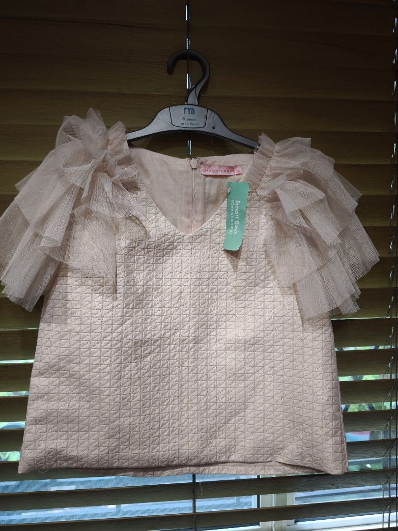 Ginger snaps pink ruffled tulle top size 14 (Category: Babies & Kids Fashion) located in Las Pinas. Submitted by modelmama (Listing ID 1443184389, Image 2). Description: - Adorable pink top from Ginger snaps - Size 14 - Features a textured fabric for a unique look - Pretty ruffled tulle sleeves - Convenient zip closure at the back - Ideal for parties and special occasions.