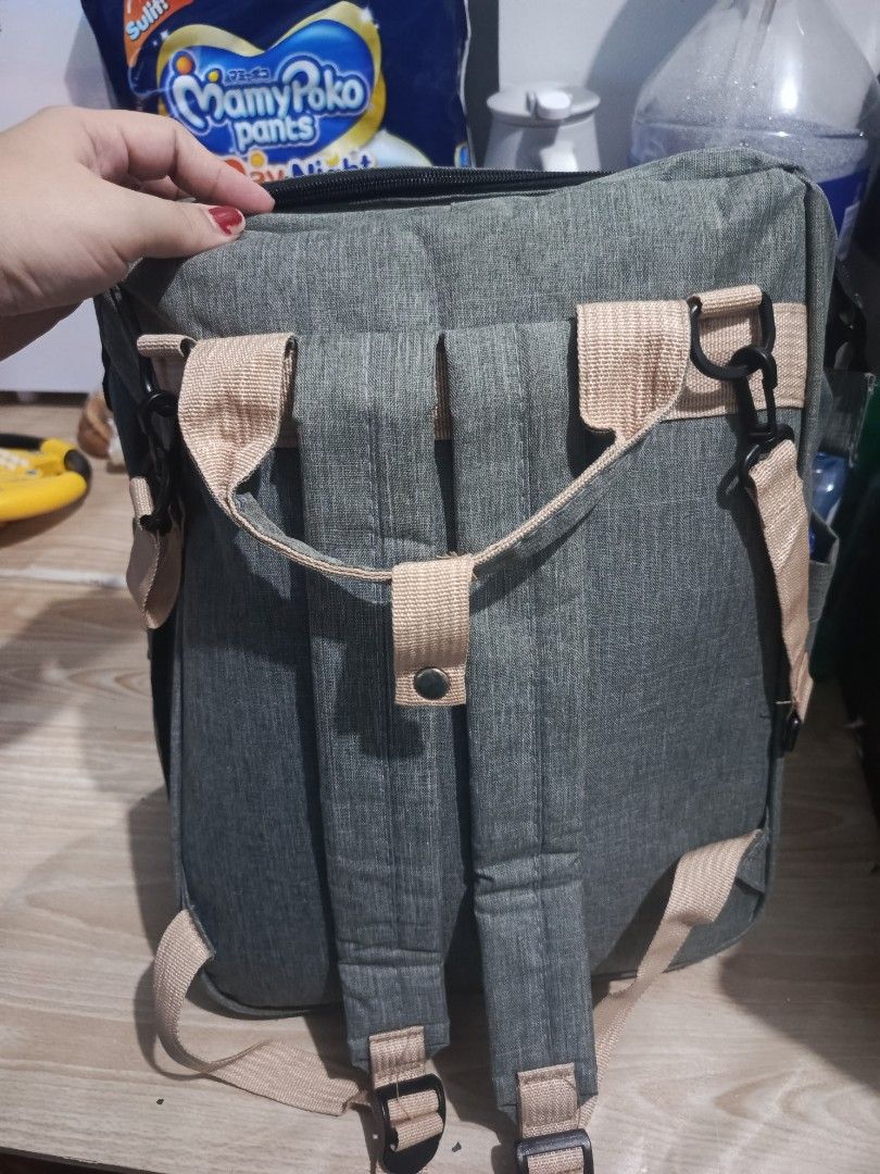Grey Diaper Bag Backpack "You Are My Sunshine" (Category: Backpacks) located in Manila. Submitted by isharishni33773 (Listing ID 1443220839, Image 2). Description: - Stylish grey diaper bag backpack with 'You Are My Sunshine' print. - Multiple straps and pockets for excellent organization of baby essentials. - Comfortable to wear as a backpack. - Made with durable material for long-lasting use. Rfs: twice lang nagamit.