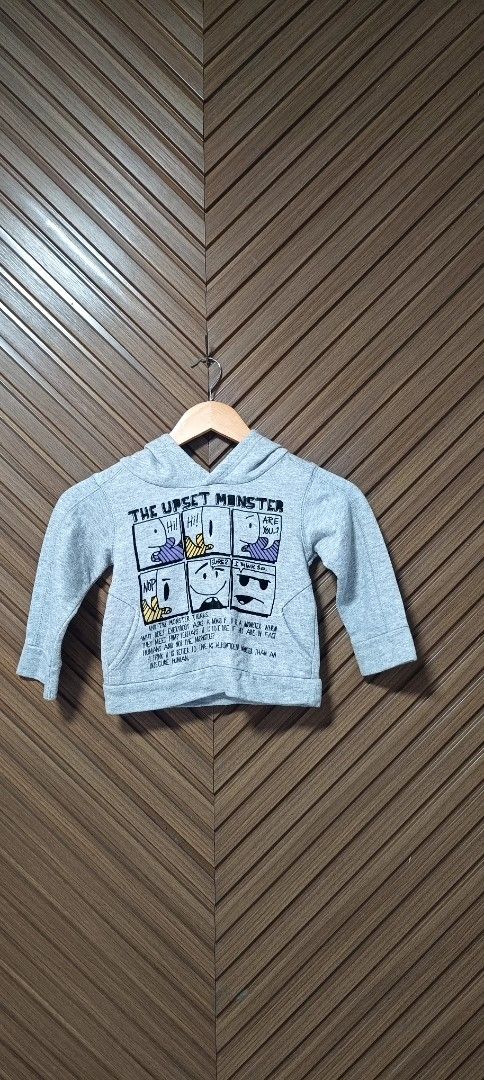 Zara Grey 'The Upset Monster' Hoodie (Category: Babies & Kids Fashion) located in Davao. Submitted by fabmegashop (Listing ID 1443243219, Image 1). Description: - Grey hoodie with fun comic strip graphic - Features 'The Upset Monster' theme - Long sleeves and hood - Ideal for casual wear - Measurements: Length approx 13 inches, Chest approx 11 inches.