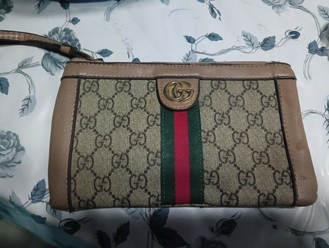 Gucci Monogram Wallet with Green and Red Stripe (Category: Luxury Bags & Wallets) located in Muntinlupa City. Submitted by cjcalcifier (Listing ID 1443274247, Image 1). Description: - Authentic Gucci wallet - Classic GG monogram canvas - Iconic green and red stripe detail - Small and portable size.