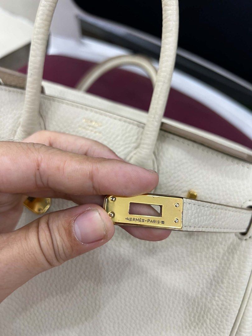 Hermes Birkin Bag - Beige Leather (Category: Luxury Bags & Wallets) located in Bacolod City. Submitted by novymaesel14868 (Listing ID 1443315027, Image 2). Description: - Authentic Hermes Birkin Bag - Material: Beige Togo Leather - Hardware: Gold - Condition: Good overall, with some signs of wear - Features: Timeless design, suitable for everyday or special occasions - Authenticity: Stamp visible.