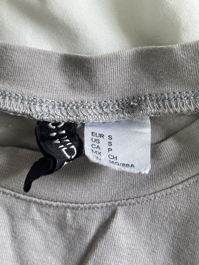 H&M Tops (Category: Shirts) located in Quezon City. Submitted by truecloud.1da3ab (Listing ID 1443245865, Image 2). Description: * ₱250 H&M gray crop top (S) * ₱200 H&M dark khaki ribbed corset-style tank top (XS).