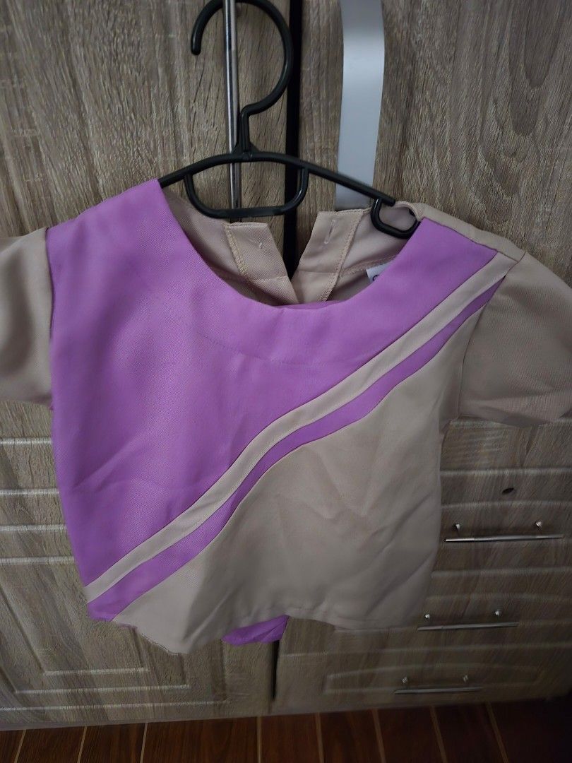 Kids' Purple and Beige Uniform Set (Category: Babies & Kids Fashion) located in Trece Martires City. Submitted by maristchrisca (Listing ID 1443163740, Image 2). Description: - Adorable beige top with purple accents and diagonal stripe design. - Matching comfortable purple pants with elastic waistband. - Short sleeves for easy movement. - Ideal for school uniforms, events, or everyday wear. - Comfortable and easy to wear for kids..