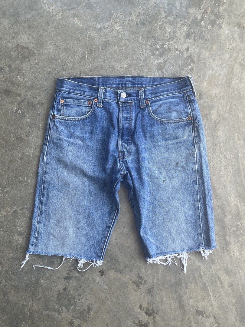 Levi's 501 Cut-Off Denim Shorts (Category: Shorts) located in San Mariano. Submitted by rakithrift (Listing ID 1443248077, Image 1). Description: - Classic Levi's 501 denim shorts - Cut-off style with frayed hem - Button fly closure - Medium blue wash with fading - Essential casual wear staple 📏 DIMES: W 32 L 20.5 T 11.5 H 9 🎨 COLOR RATE: 9/10 ✅ CONDITION: WELL USED ❌ ISSUE: ALTERED (pants to jorts), stains.