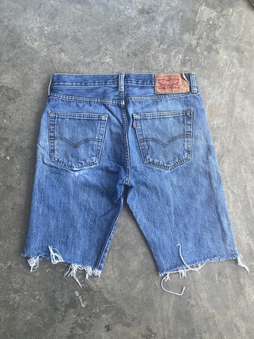 Levi's 501 Cut-Off Denim Shorts (Category: Shorts) located in San Mariano. Submitted by rakithrift (Listing ID 1443248077, Image 2). Description: - Classic Levi's 501 denim shorts - Cut-off style with frayed hem - Button fly closure - Medium blue wash with fading - Essential casual wear staple 📏 DIMES: W 32 L 20.5 T 11.5 H 9 🎨 COLOR RATE: 9/10 ✅ CONDITION: WELL USED ❌ ISSUE: ALTERED (pants to jorts), stains.