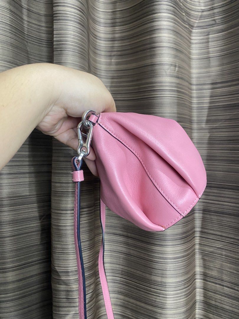 Loewe Elephant Mini Bag Pink Leather (Category: Luxury Bags & Wallets) located in Tacloban City. Submitted by houseofluxury.co (Listing ID 1443249766, Image 3). Description: - Adorable pink elephant bag from Loewe - Crafted from genuine leather - Features a stylish crossbody strap with a unique knot detail - Secure zipper closure - Compact size, ideal for carrying your essentials - Adds a vibrant pop of color to any look - Includes a detachable s