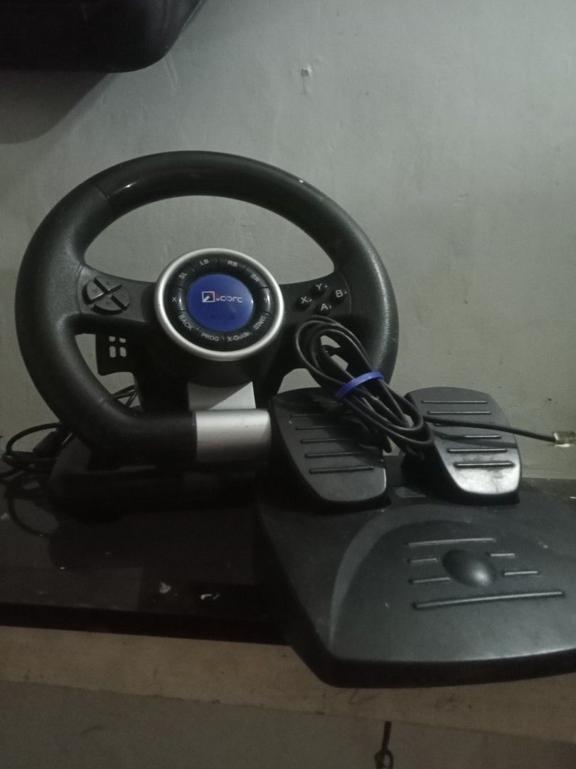 Logitech Driving Force GT Gaming Steering Wheel and Pedals (Category: Controllers) located in Paranaque City. Submitted by abbsss (Listing ID 1443137495, Image 2). Description: - Logitech Driving Force GT steering wheel and pedals set - USB connection - Excellent for racing games - Includes steering wheel and two-pedal set - Ready for your next race!.