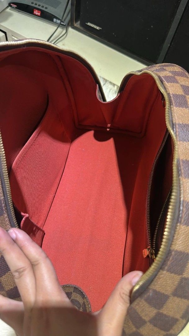 Louis Vuitton Damier Ebene Speedy Bag (Category: Luxury Bags & Wallets) located in Batangas. Submitted by fendi.closet (Listing ID 1443191477, Image 3). Description: - Classic Louis Vuitton Speedy bag - Authentic Damier Ebene canvas - Iconic checkered pattern - Spacious interior with red lining - Secure zipper closure - Comfortable top handles - Timeless and versatile for daily use.