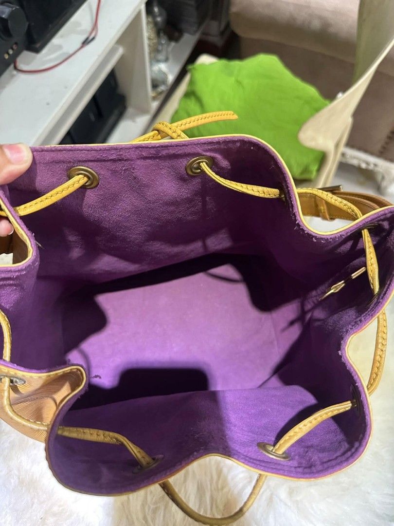 Louis Vuitton Epi Leather Bucket Bag (Category: Luxury Bags & Wallets) located in Batangas. Submitted by fendi.closet (Listing ID 1443192298, Image 3). Description: - Authentic Yellow Epi Leather Louis Vuitton Bucket Bag - Chic Purple Interior - Secure Drawstring Closure - Durable Leather Straps - Iconic LV Design - Ideal for Everyday Use - Generously Spacious.