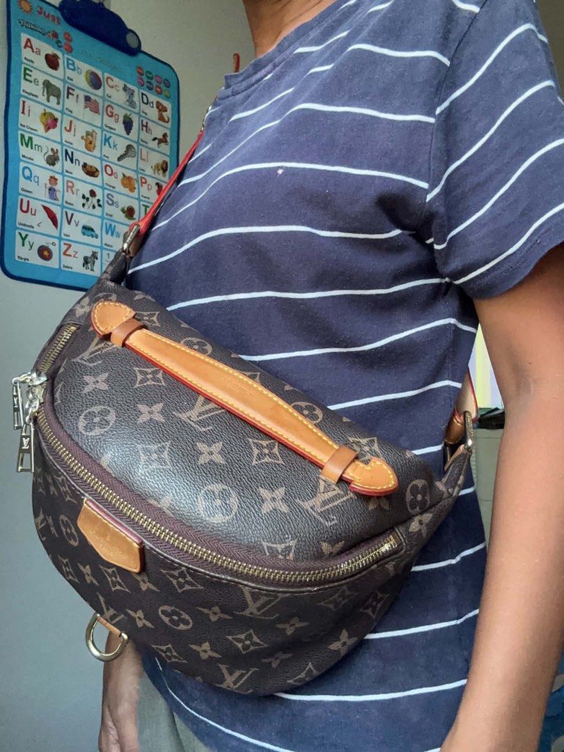 Louis Vuitton Monogram Canvas Bumbag (Category: Luxury Bags & Wallets) located in Binmaley. Submitted by maryjeyn (Listing ID 1443199543, Image 2). Description: - Classic Louis Vuitton Monogram Canvas Bumbag - Color: Brown and Tan - Hardware: Gold-tone - Adjustable strap for waist or crossbody wear - Perfect for everyday essentials - Note: Shows some signs of wear on leather trim and strap - With Freebies -Still Nego for sure buyers only!.