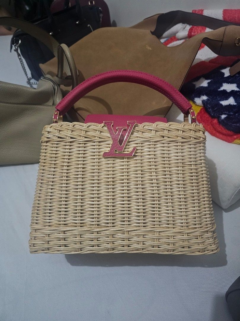 LV Capucines Woven Bag (Category: Luxury Bags & Wallets) located in Quezon City. Submitted by dhexyoblepias (Listing ID 1443141759, Image 1). Description: - Authentic Louis Vuitton woven bag - Features a stylish pink leather handle - Comes with a detachable pink leather strap with gold hardware - Elegant woven exterior with pink leather accents - Ideal for your summer adventures - Includes original Louis Vuitton dust bag.
