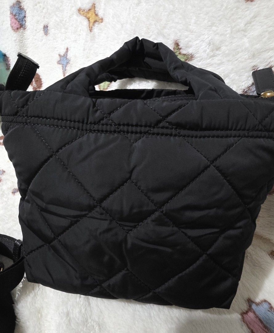Marc Jacobs Quilted Nylon Mini Tote Bag (Category: Luxury Bags & Wallets) located in Mandaluyong City. Submitted by mlstuff28 (Listing ID 1443251842, Image 3). Description: - Authentic - Material: Quilted nylon - Color: Black - Style: Mini tote bag - Features: Top handles, detachable crossbody strap, gold hardware, interior zip pocket - Ideal for: Everyday use, travel Mop: bank transfer/ gcash.