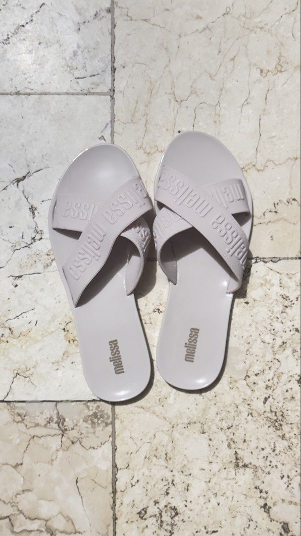 Melissa Pink Cross Strap Jelly Sandals (Category: Flats & Sandals) located in Manila. Submitted by keiscart_ (Listing ID 1443237655, Image 1). Description: Light pink Melissa jelly sandals with a criss-cross strap design and embossed logo. Easy slip-on style, perfect for casual wear. Marked 'vegan' on the sole. .