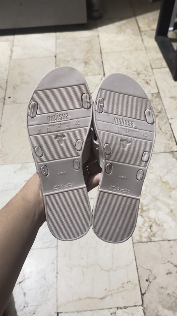 Melissa Pink Cross Strap Jelly Sandals (Category: Flats & Sandals) located in Manila. Submitted by keiscart_ (Listing ID 1443237655, Image 3). Description: Light pink Melissa jelly sandals with a criss-cross strap design and embossed logo. Easy slip-on style, perfect for casual wear. Marked 'vegan' on the sole. .