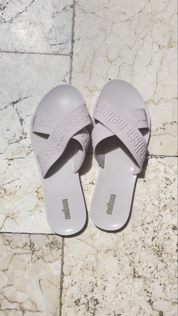Melissa Pink Cross Strap Jelly Sandals (Category: Flats & Sandals) located in Manila. Submitted by keiscart_ (Listing ID 1443237655, Image 2). Description: Light pink Melissa jelly sandals with a criss-cross strap design and embossed logo. Easy slip-on style, perfect for casual wear. Marked 'vegan' on the sole. .