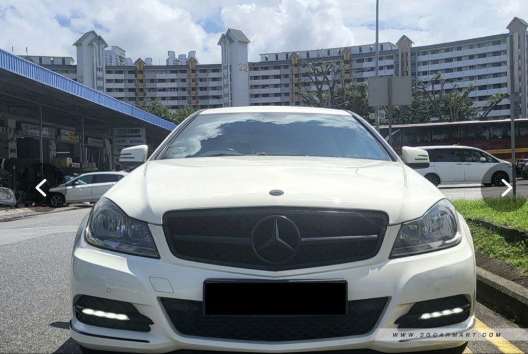 Mercedes-Benz C-Class Coupe C180 (A) (Category: Used Cars) located in Singapore. Submitted by bambs19 (Listing ID 1443190751, Image 2). Description: NOT LOOKING FOR CAR DEALERS. PLEASE ONLY PM IF YOU ARE A DIRECT BUYER. Original white colour. No modifications. Took care of the car very well, it’s hard to believe it’s 15 years old now. Changed to brand new rims and tyres in 2025. Proper and regular maintenance and servicing. Have to let go due to 