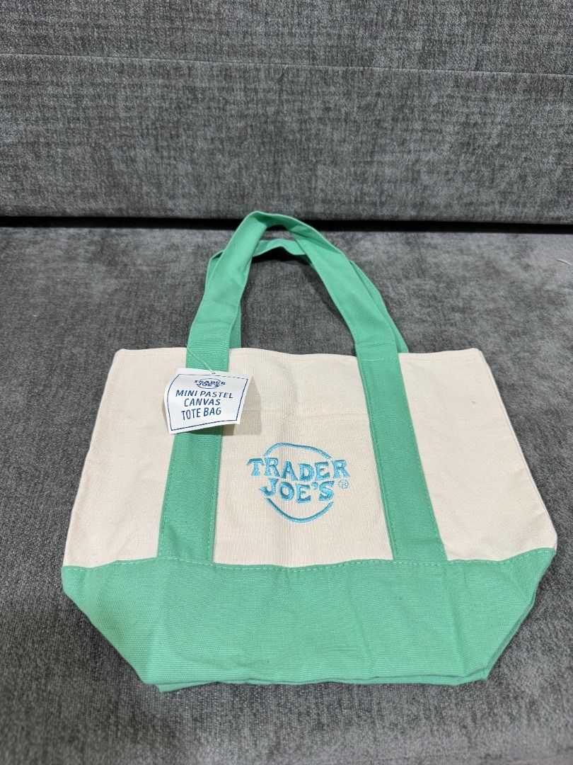 Mini Tote Trader Joe's Pastel (Category: Tote Bags) located in Quezon City. Submitted by trainforless (Listing ID 1443139162, Image 3). Description: FROM NEW YORK!! ALL COLORS AVAILABLE, 600 EACH :) Snagged this highly sought-after, limited-edition mini tote! Perfect for quick errands, lunch dates, or as a cute everyday micro-bag. Sturdy canvas material with the iconic Trader Joe's embroidery. Condition: 100% Brand New with Tags (BNWT) Material: 