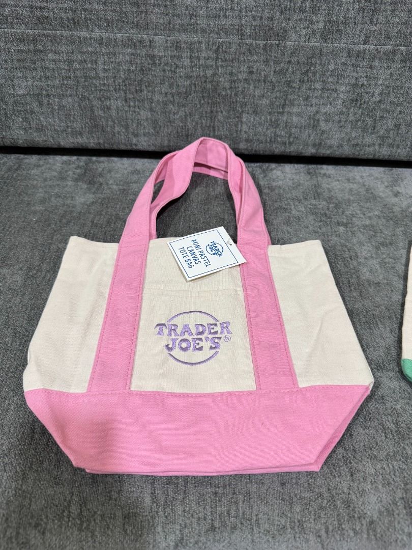Mini Tote Trader Joe's Pastel (Category: Tote Bags) located in Quezon City. Submitted by trainforless (Listing ID 1443139162, Image 2). Description: FROM NEW YORK!! ALL COLORS AVAILABLE, 600 EACH :) Snagged this highly sought-after, limited-edition mini tote! Perfect for quick errands, lunch dates, or as a cute everyday micro-bag. Sturdy canvas material with the iconic Trader Joe's embroidery. Condition: 100% Brand New with Tags (BNWT) Material: 