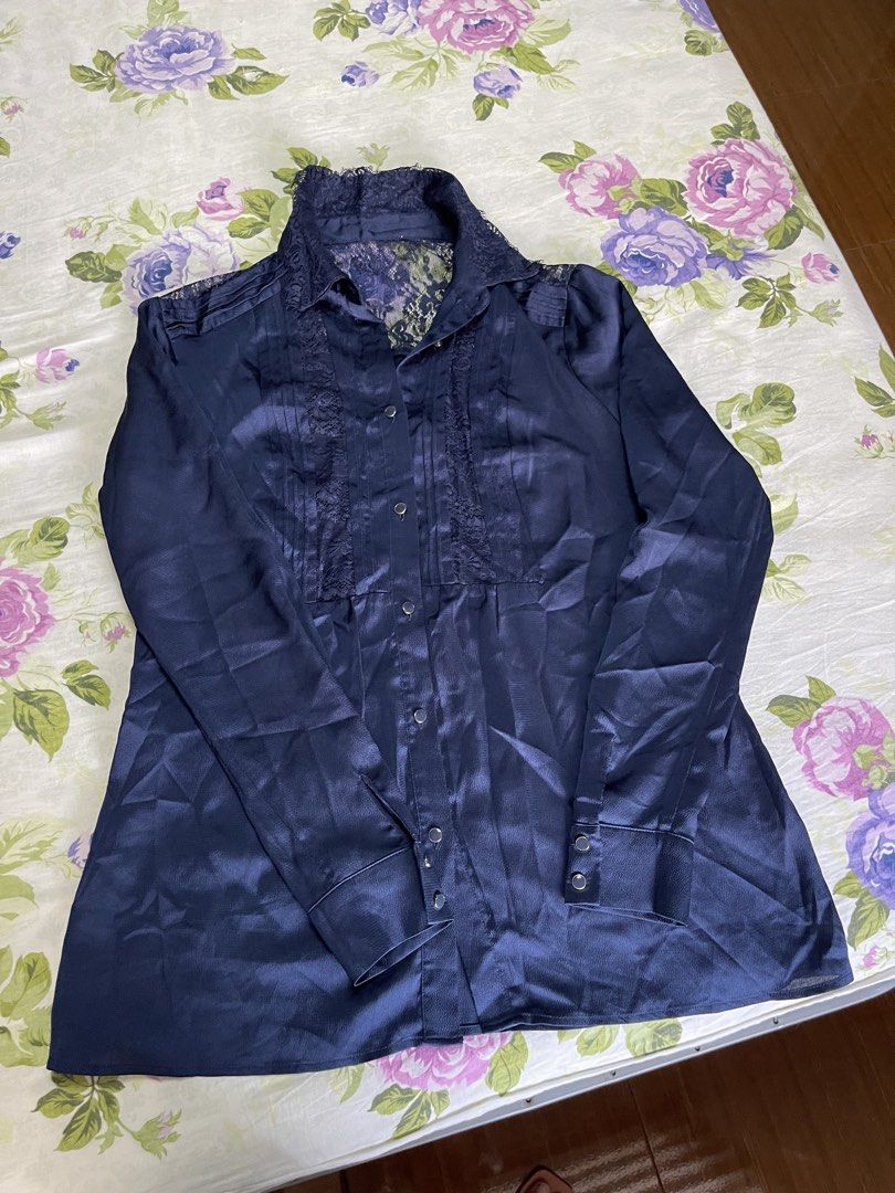 Navy Blue Satin Lace Button-Up Shirt (Category: Shirts) located in Manila. Submitted by anicascloset (Listing ID 1443129840, Image 1). Description: - Chic navy blue satin shirt - Delicate lace detailing on collar and front placket - Long sleeves with button cuffs - Classic button-up front closure - Luxurious fabric with a beautiful sheen - Effortlessly transitions from day to night - Perfect for office wear or a night out.
