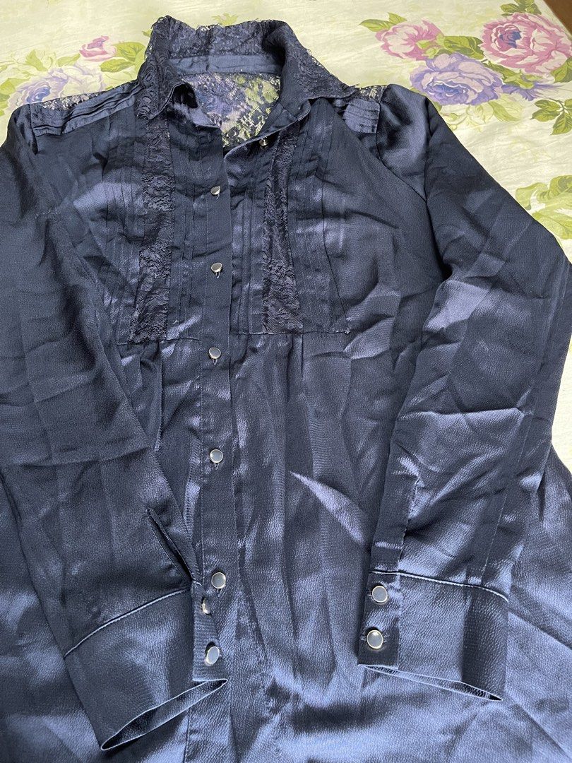 Navy Blue Satin Lace Button-Up Shirt (Category: Shirts) located in Manila. Submitted by anicascloset (Listing ID 1443129840, Image 3). Description: - Chic navy blue satin shirt - Delicate lace detailing on collar and front placket - Long sleeves with button cuffs - Classic button-up front closure - Luxurious fabric with a beautiful sheen - Effortlessly transitions from day to night - Perfect for office wear or a night out.