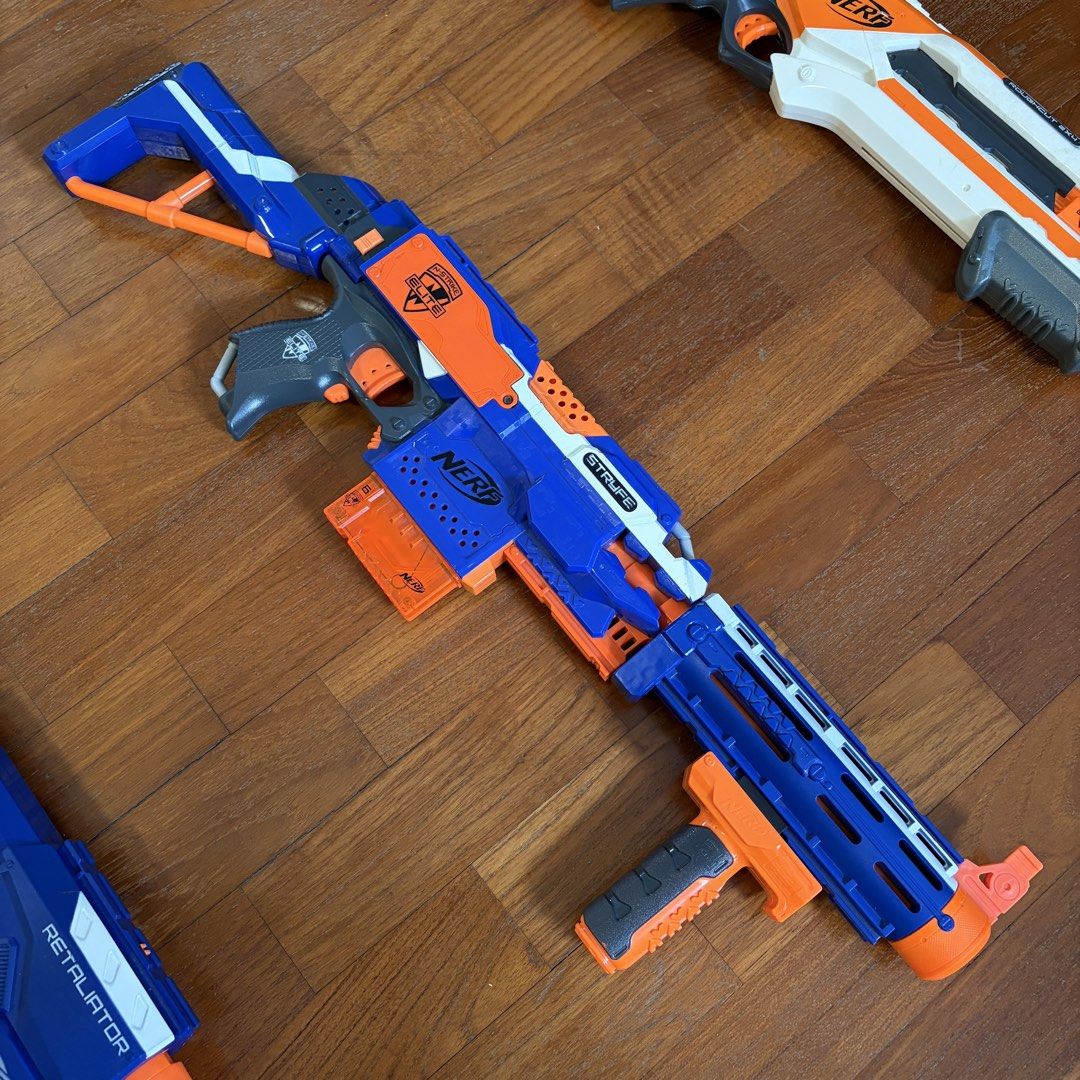 Nerf Blaster Bundle (Category: Action & Battle Toys) located in Singapore. Submitted by needamaxwin (Listing ID 1443193130, Image 3). Description: Nerf N-Strike Elite Stryfe Fully functional motorised blaster. Some light scuff marks from normal use, no cracks or broken parts. Compatible with all N-Strike Elite attachments and magazines. Batteries not included. Price: $20 (ONLY Blaster) Nerf N-Strike Elite Retaliator Fully functional pump action b