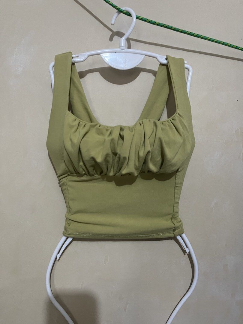 Olive Green Ruched Bust Crop Top Tank (Category: Others Tops) located in Malabon City. Submitted by abeilleshop (Listing ID 1443167877, Image 3). Description: - small - stretchable - Cute olive green crop top - Ruched detail on the bust - Square neckline - Tank straps - Stretchy material - Versatile: pairs well with high-waisted jeans or skirts - Suitable for casual outings or nights out.