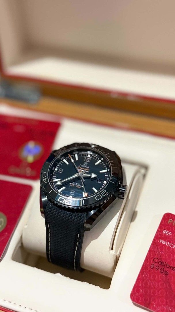 Omega Seamaster Planet Ocean GMT Watch (Category: Luxury Watches) located in Balanga. Submitted by affinity20 (Listing ID 1443205208, Image 2). Description: - Omega Seamaster Planet Ocean GMT - Striking black dial with vibrant orange accents - Complete set: Original box and papers included - Comfortable black rubber strap with secure deployant clasp - Ideal for globetrotters and everyday elegance -with box and cards.