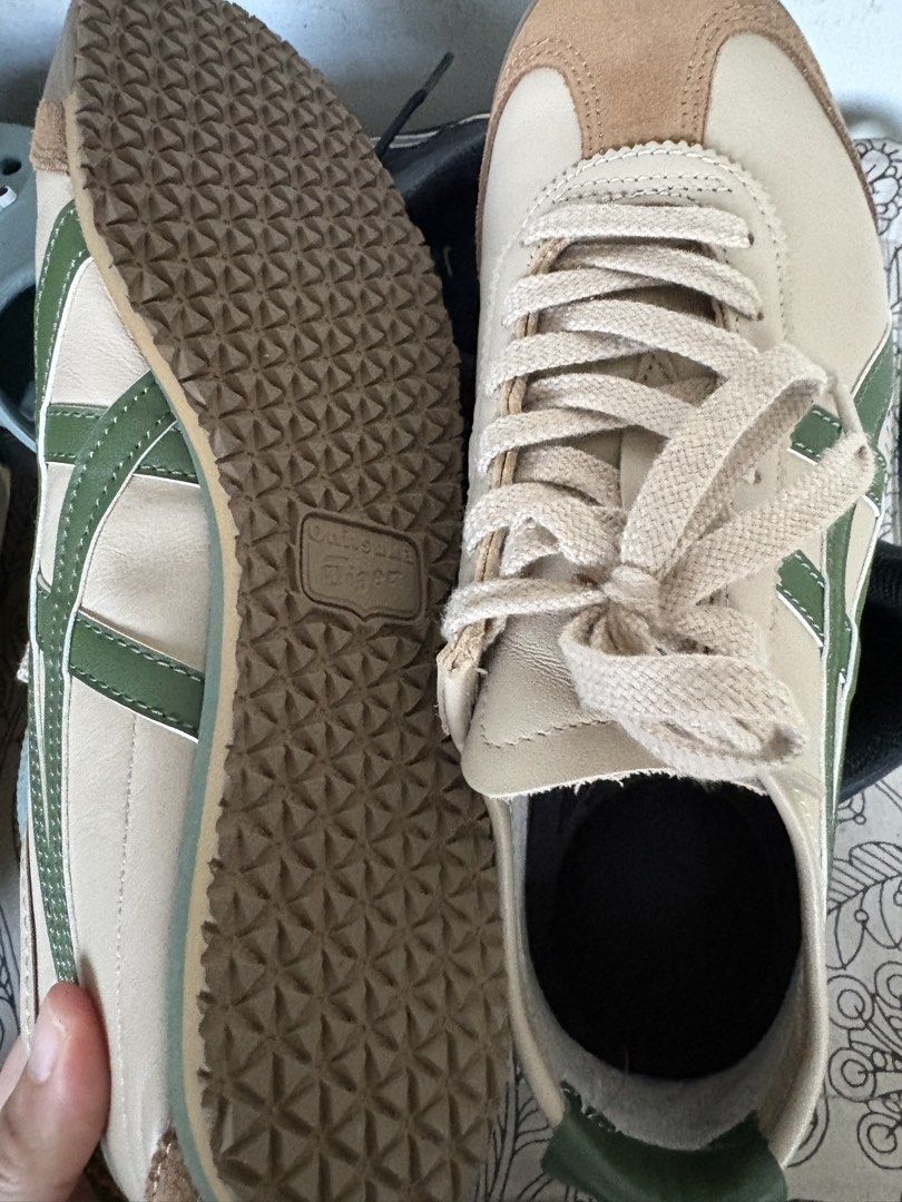 Onitsuka Tiger Mexico 66 Beige Green Suede Sneakers (Category: Sneakers) located in Singapore. Submitted by liu800 (Listing ID 1443316623, Image 2). Description: - Classic Onitsuka Tiger Mexico 66 sneakers - Beige and brown suede with iconic green stripes - Perfect for casual, everyday wear - Durable soles with excellent grip - Comes with beige laces - A stylish addition to any outfit - Size is US 6.5 & 24.5cm.