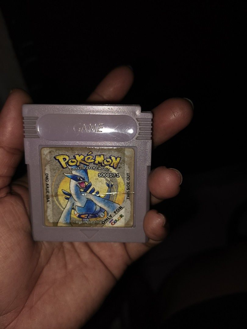 Pokemon Silver Version Game Boy Color Cartridge (Category: Nintendo) located in Del Monte. Submitted by anitagalan89774 (Listing ID 1443262593, Image 2). Description: - Pokemon Silver Version cartridge for Game Boy Color - Features Lugia on the label - Designed for color Game Boy systems - Cartridge is in good working condition - Label shows some wear but remains readable - Ideal for Pokemon collectors and fans.