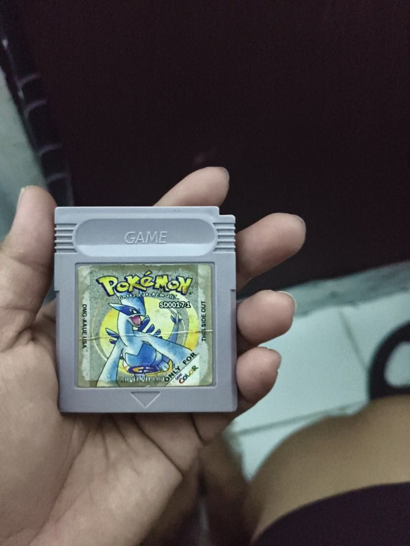 Pokemon Silver Version Game Boy Color Cartridge (Category: Nintendo) located in Del Monte. Submitted by anitagalan89774 (Listing ID 1443262593, Image 1). Description: - Pokemon Silver Version cartridge for Game Boy Color - Features Lugia on the label - Designed for color Game Boy systems - Cartridge is in good working condition - Label shows some wear but remains readable - Ideal for Pokemon collectors and fans.
