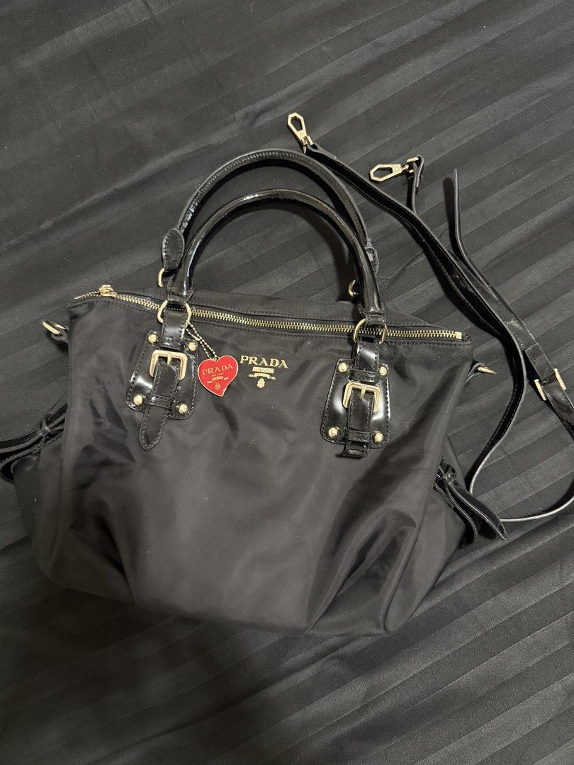 Prada Nylon Tessuto Satchel Bag Black (Category: Luxury Bags & Wallets) located in Manila. Submitted by dkg.zz (Listing ID 1443221940, Image 1). Description: ✨ PRADA BAG ✨ 👜 Good as new ✨ Elegant gold hardware 🎀 Comes with sling strap and keychain 🖤 Premium nylon texture ✅ Well-maintained and ready to use 💰 ₱5,500 only A timeless and stylish bag that’s perfect for any occasion. Message me to reserve yours! 📩.