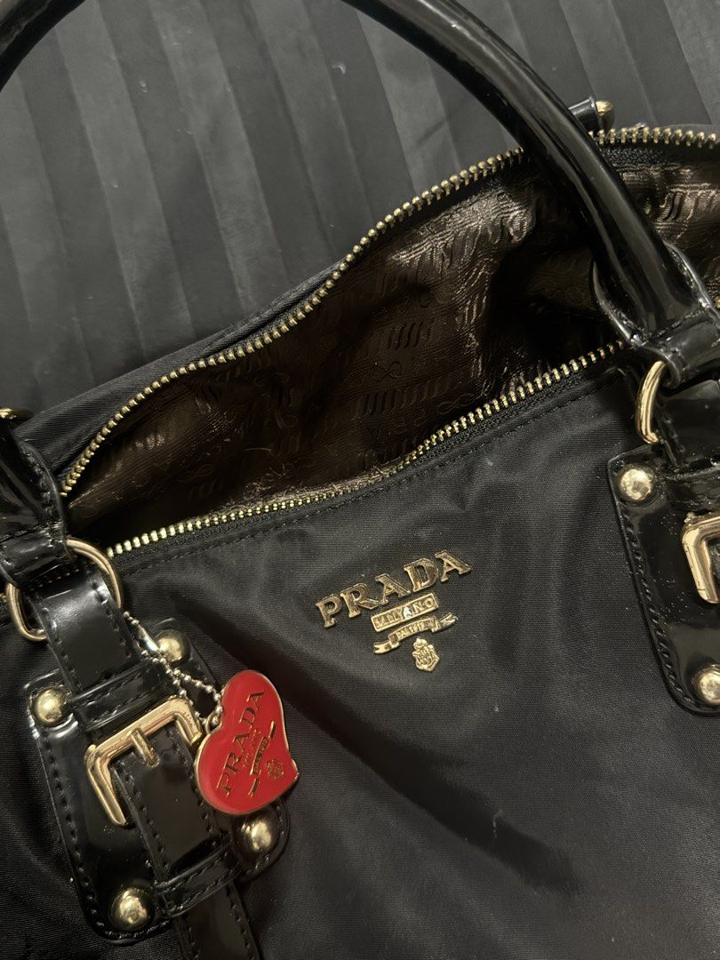 Prada Nylon Tessuto Satchel Bag Black (Category: Luxury Bags & Wallets) located in Manila. Submitted by dkg.zz (Listing ID 1443221940, Image 2). Description: ✨ PRADA BAG ✨ 👜 Good as new ✨ Elegant gold hardware 🎀 Comes with sling strap and keychain 🖤 Premium nylon texture ✅ Well-maintained and ready to use 💰 ₱5,500 only A timeless and stylish bag that’s perfect for any occasion. Message me to reserve yours! 📩.