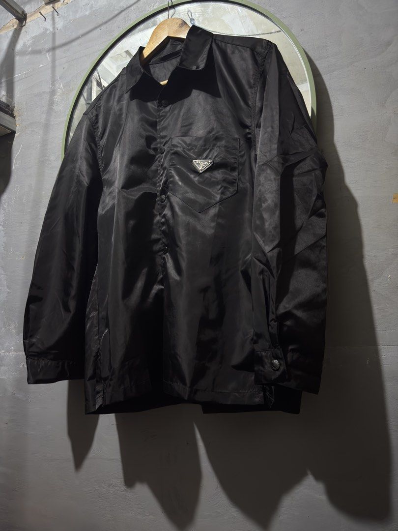 Prada ReNylon Shirt Jacket (Category: Luxury Apparel) located in Manila. Submitted by tindero-ng-damit (Listing ID 1443037049, Image 2). Description: Prada Emblem Pocket Re-Nylon Shirt Jacket Snap Buttons Prada Hardware Size M - 24 x 29 Excellent Condition - Flawless Issues: None - needs to steam or flat iron DM.