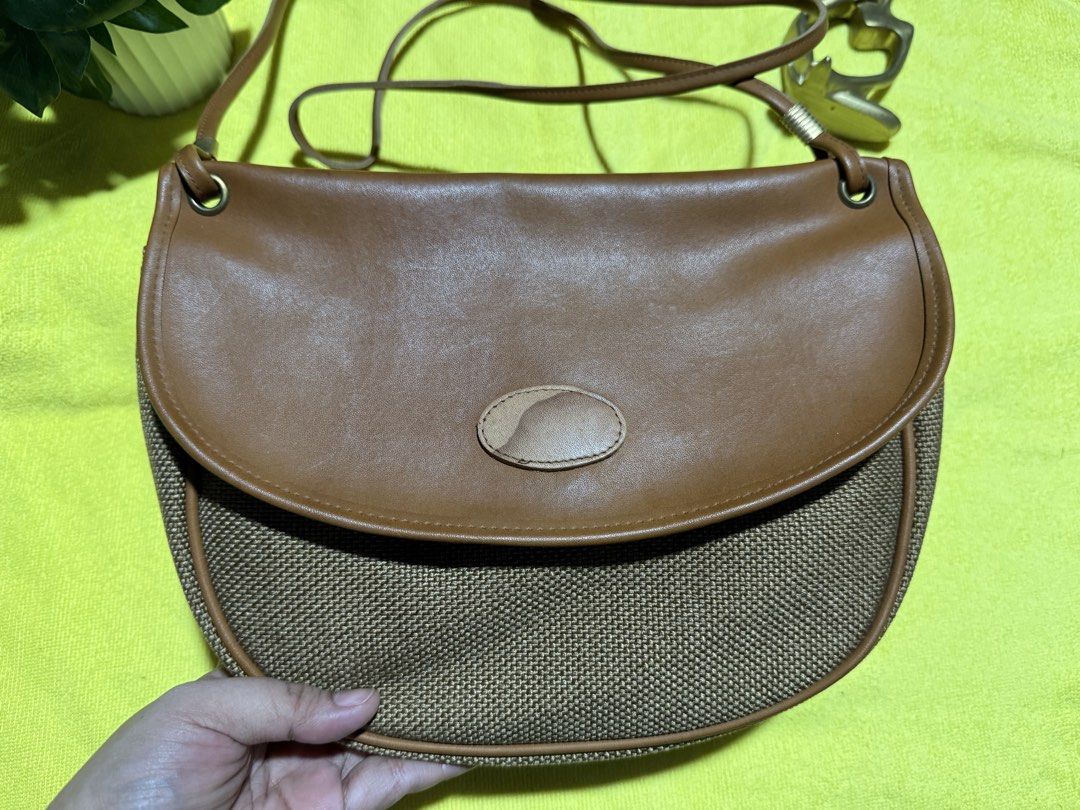 Preloved sling bag from Japan (Category: Cross-body Bags) located in Rizal. Submitted by jayolts (Listing ID 1443288775, Image 3). Description: Sling bag from Japan Parang PU leather pero super new pa no rubs or tears Sling is excellent condition Gold plated hardwares Inner lining leather no bak bak or lag kit Kasya long wallet and big phones ☺️.