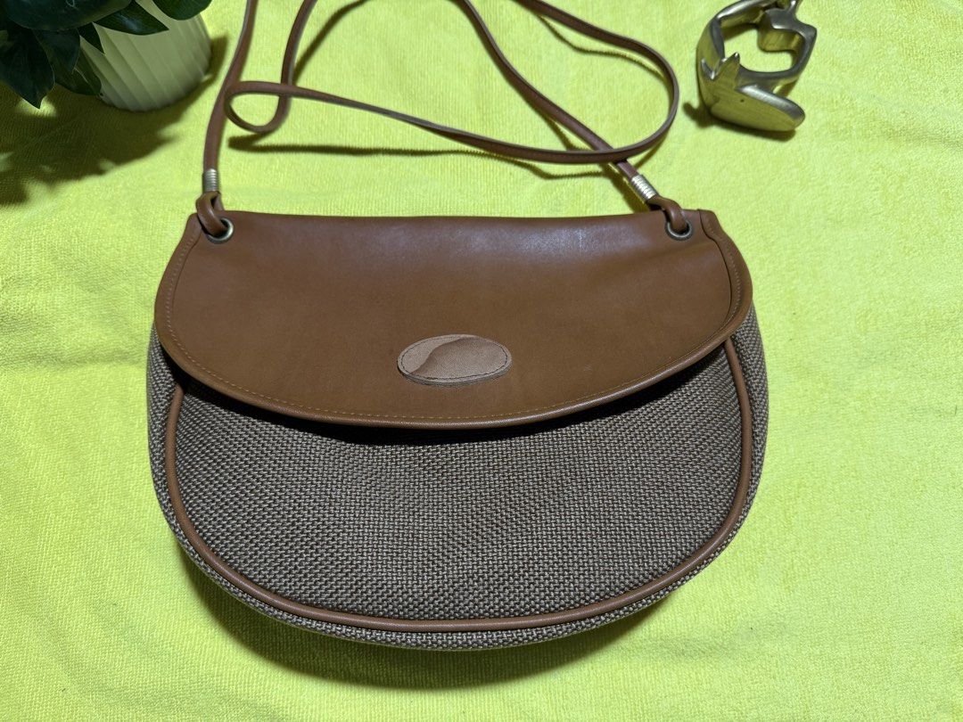 Preloved sling bag from Japan (Category: Cross-body Bags) located in Rizal. Submitted by jayolts (Listing ID 1443288775, Image 2). Description: Sling bag from Japan Parang PU leather pero super new pa no rubs or tears Sling is excellent condition Gold plated hardwares Inner lining leather no bak bak or lag kit Kasya long wallet and big phones ☺️.