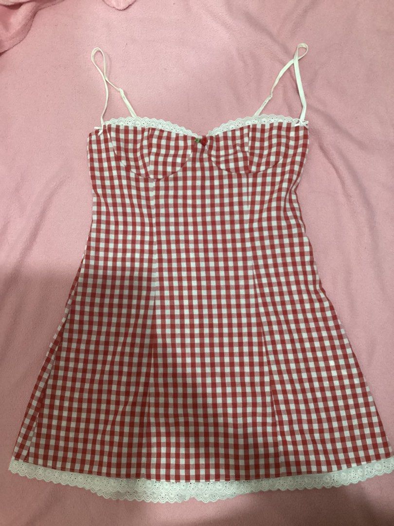 Red Gingham Mini Dress (Category: Dresses) located in Cavite. Submitted by pompompurines (Listing ID 1443274329, Image 1). Description: - Red and white gingham mini dress - Sweetheart neckline with lace trim - Adjustable spaghetti straps - Lace detail at the hem - Ideal for summer picnics or casual outings - Sweet and feminine style location: Imus, Cavite NO WHEN WORN.