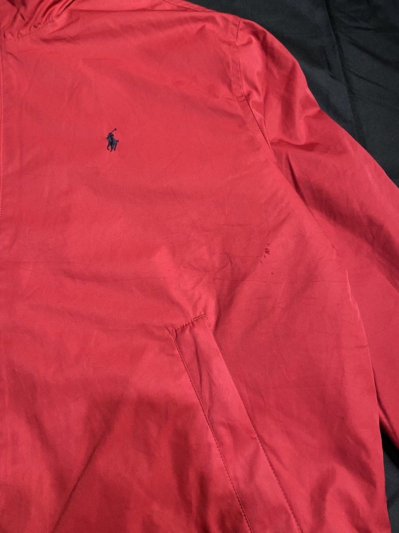 Vintage Polo Ralph Lauren Windbreaker Jacket (Category: Coats, Jackets and Outerwear) located in Cabanatuan. Submitted by frognmonkey (Listing ID 1443224556, Image 2). Description: Measurements Width: 26.5” Length: 27.5” - Classic red Polo Ralph Lauren with packable hood - Signature pony logo embroidered on chest - Quilted lining for extra warmth - Zipper closure with leather pull tab - Minor marks and a tiny holes on the front (as pictured) - Id