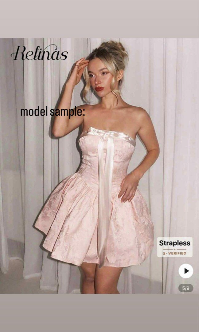 Relinas Strapless Pink Brocade Mini Dress (Category: Dresses) located in Manila. Submitted by kyotimoby (Listing ID 1443219215, Image 1). Description: - Pink strapless mini dress - Elegant brocade pattern - Satin bow detail at the bust - Ribbon tie for adjustable fit - Voluminous balloon-shaped skirt - Ideal for parties and special occasions - Pair with heels for a complete party look.