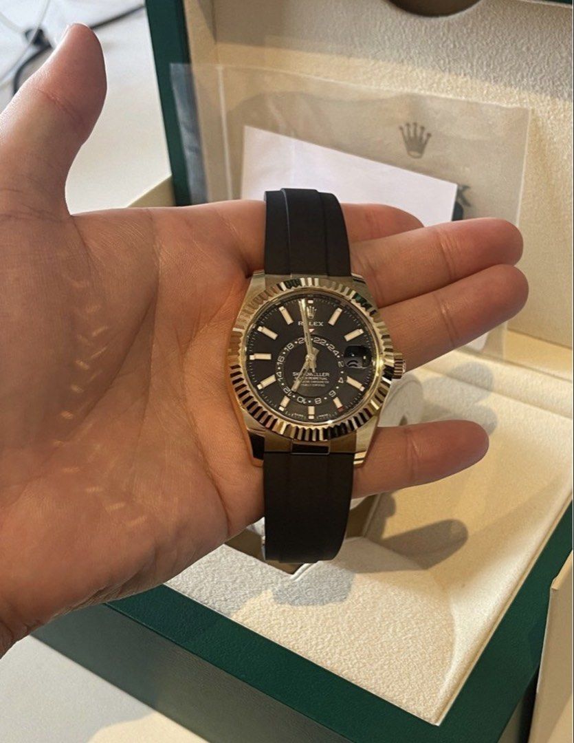 Rolex Sky-Dweller Yellow Gold Black Dial Rubber Strap 326238 (Category: Watches) located in Singapore. Submitted by wanderer1221 (Listing ID 1443215232, Image 2). Description: Rolex Sky-Dweller in yellow gold with black dial and rubber strap. Full set (box & papers). Perfect for travel and daily use. Item is in mint condition Factory sticker is still intact for back casing and clasp. Rolex sky dweller yellow gold black dial ref: 326238 Watch is w