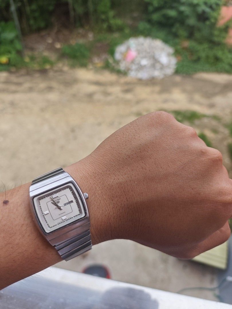 Seiko 5 Tank Automatic (Category: Luxury Watches) located in Tagbilaran City. Submitted by fleetingticks (Listing ID 1443219712, Image 2). Description: - Vintage Seiko automatic watch - Silver tone stainless steel bracelet and case - Square face with day and date complication - Clean dial with simple markers - Runs well - Great for daily wear or collectors.
