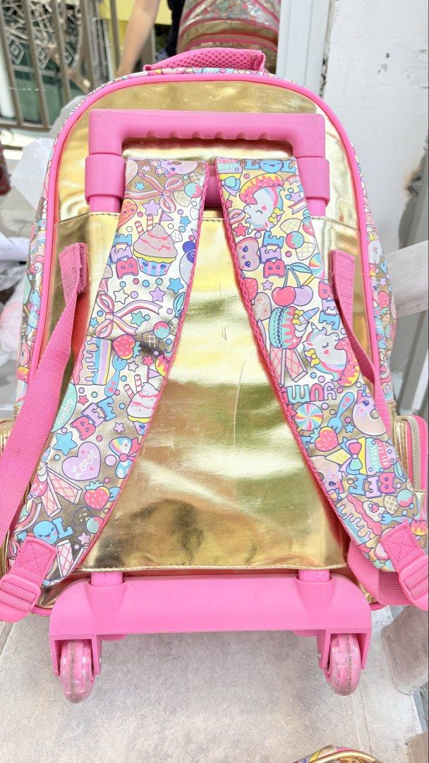 Smiggle Sequin & Print Rolling Backpack and Lunchbox Set (Category: Babies & Kids Fashion) located in Cavite. Submitted by savannahluish (Listing ID 1443162580, Image 2). Description: - Note: Minor scuffs present on the wheels and the back of the backpack straps. laba lang po mukhang bago na ulit. last year lang po eto nagamit may kapalitan pa kaya hndi po gamit na gamit.