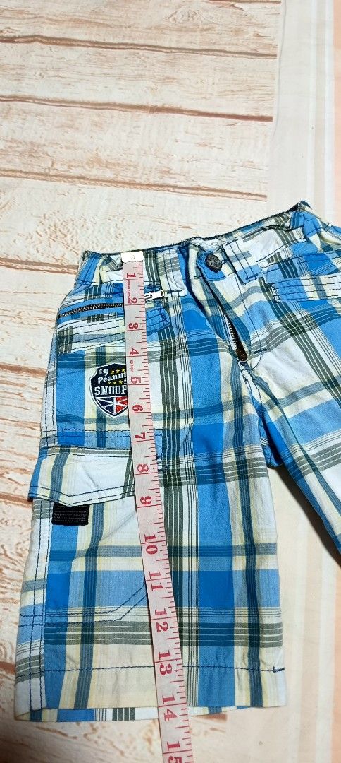 Snoopy Plaid Cargo Shorts Blue White (Category: Babies & Kids Fashion) located in Davao. Submitted by fabmegashop (Listing ID 1443241207, Image 3). Description: - Adorable Snoopy shorts for kids - Classic blue and white plaid design - Functional cargo pockets on the sides - Comfortable elastic waistband - Ideal for casual wear and playtime - Measurements available in the photos.